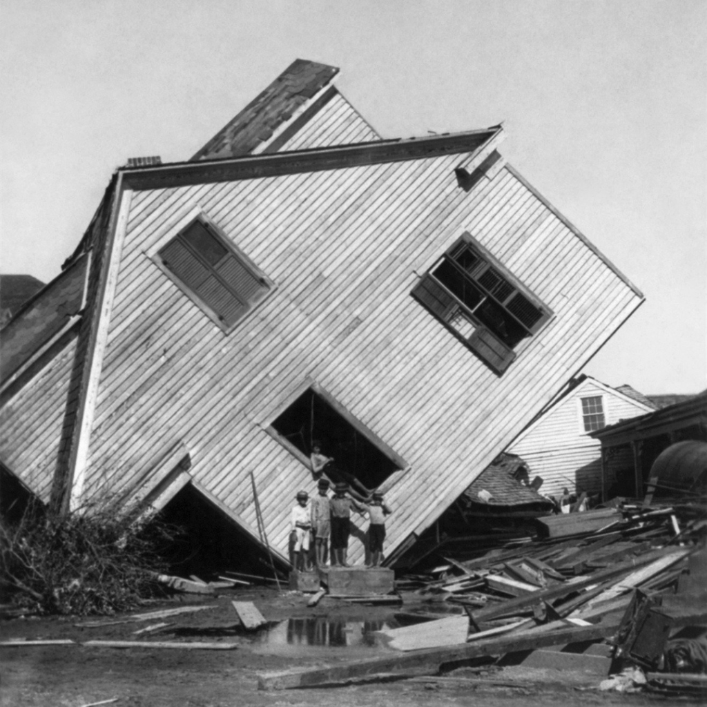 Empty house tipped on its side after a natural disaster