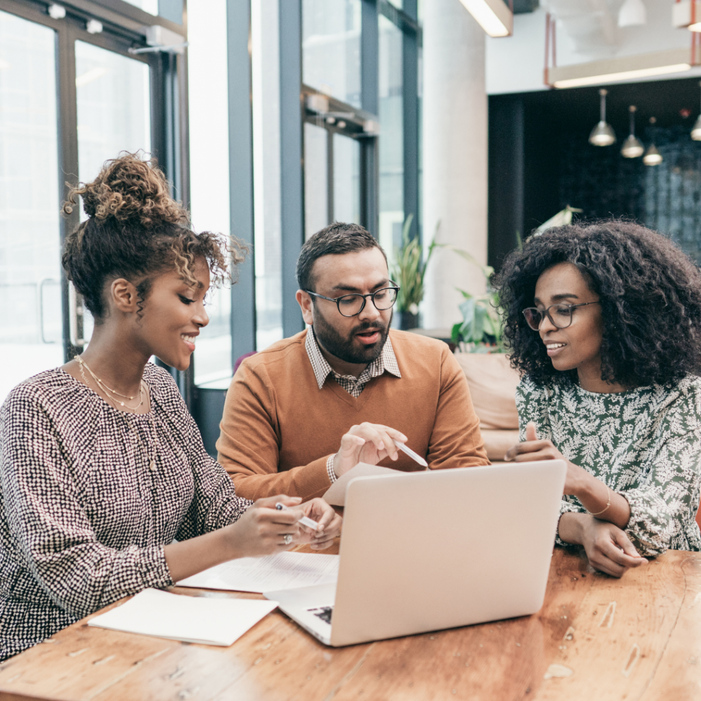 A couple sitting at a table meeting with an expert advisor.