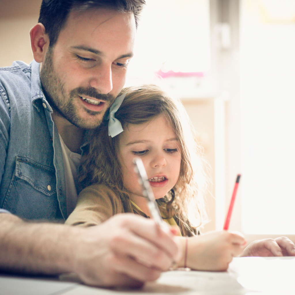 A father doing roadschooling work with his daughter